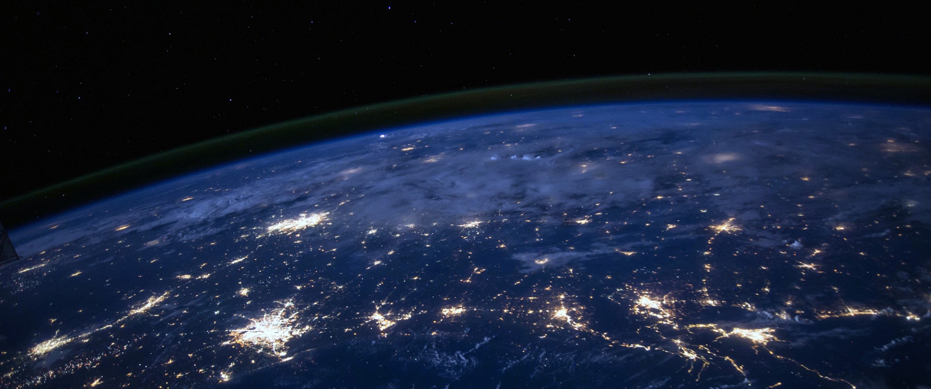 Planet Earth's surface with electric lights visible